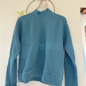 The north face waist length top.